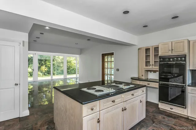 a kitchen with a stove and a refrigerator