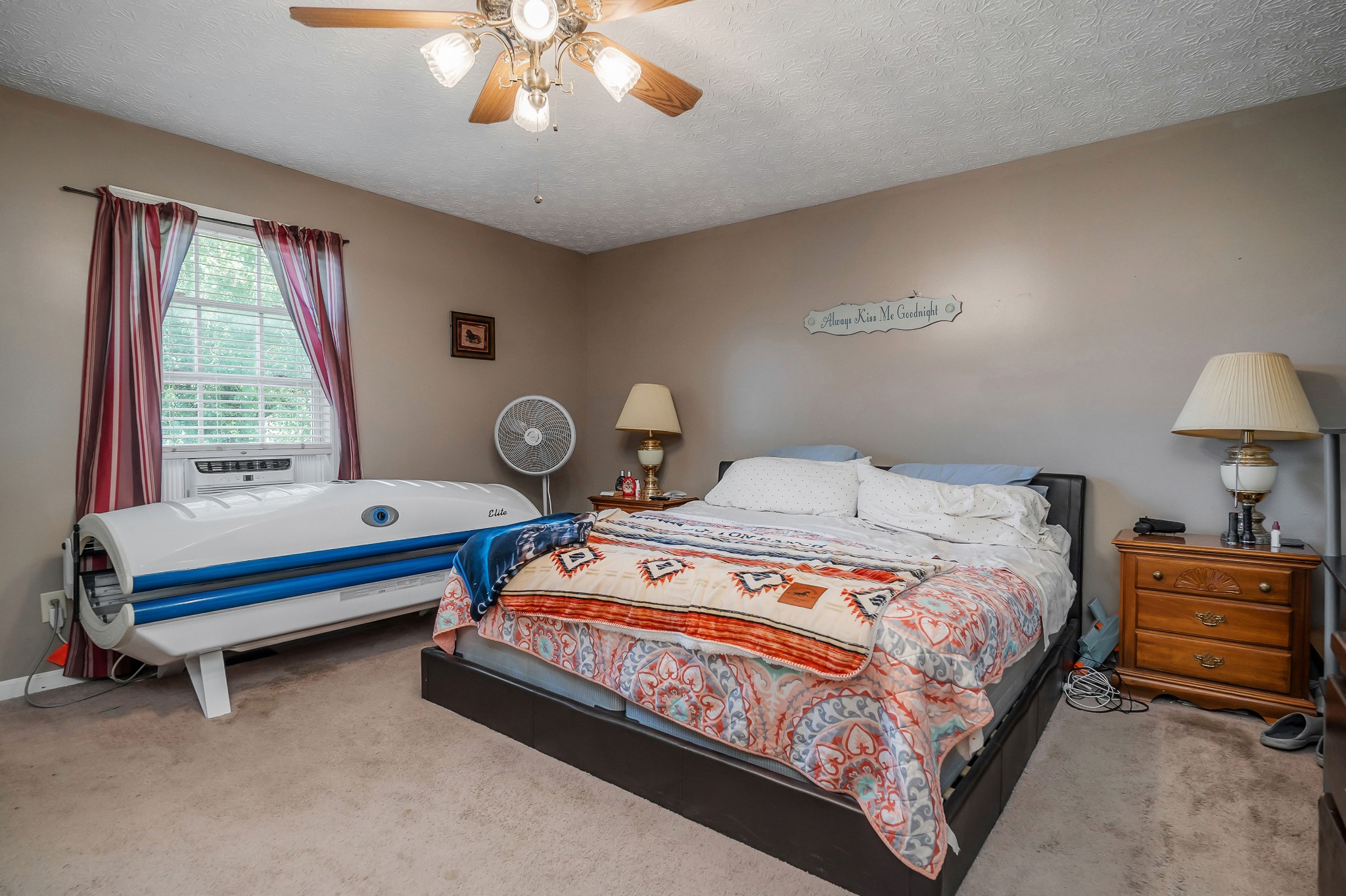 409 Kendra Drive Smithville, TN 37166 - Photo 14 of 27 a bedroom with a bed and a chandelier