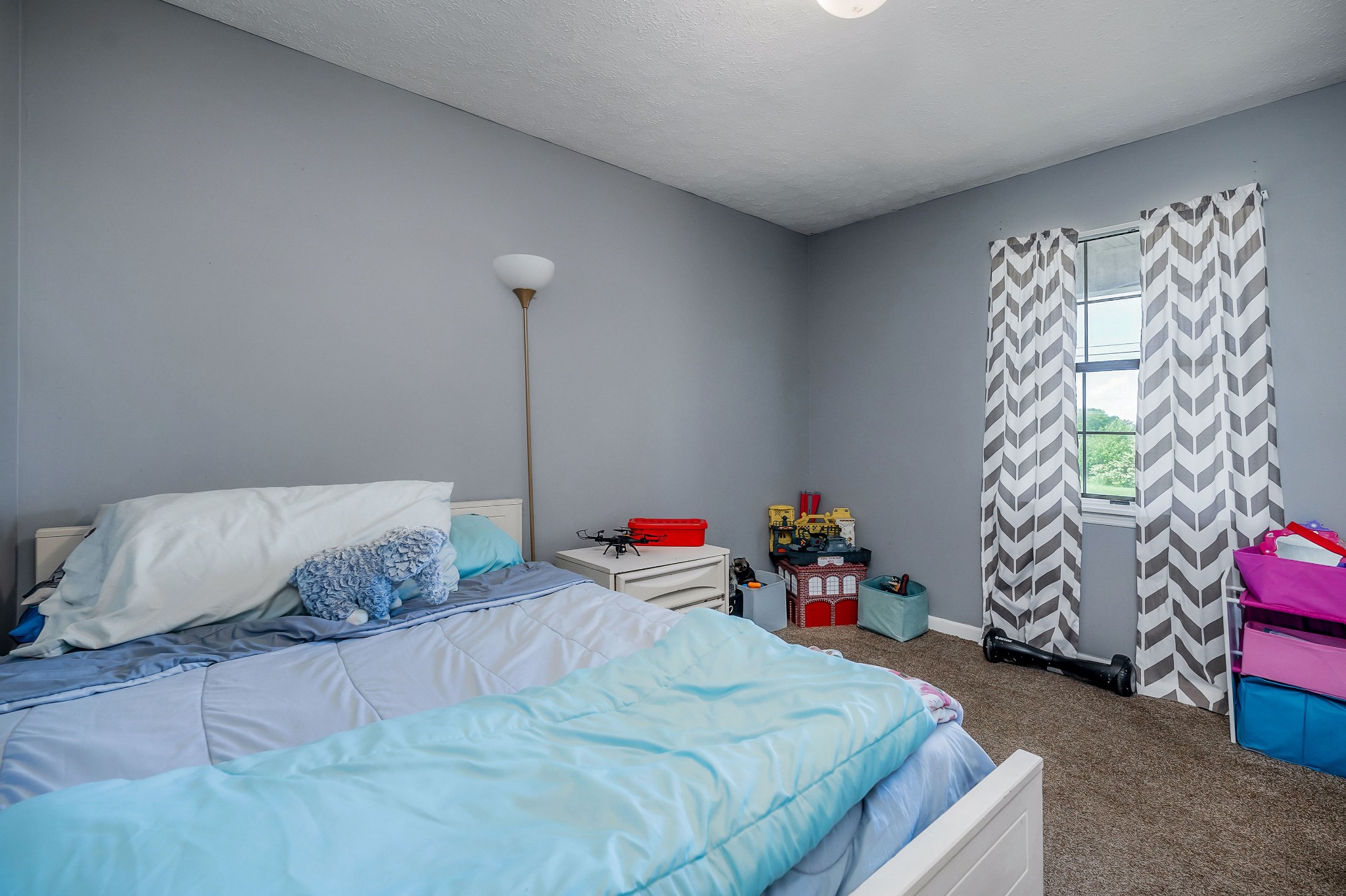 409 Kendra Drive Smithville, TN 37166 - Photo 15 of 27 a bedroom with a bed and a couch