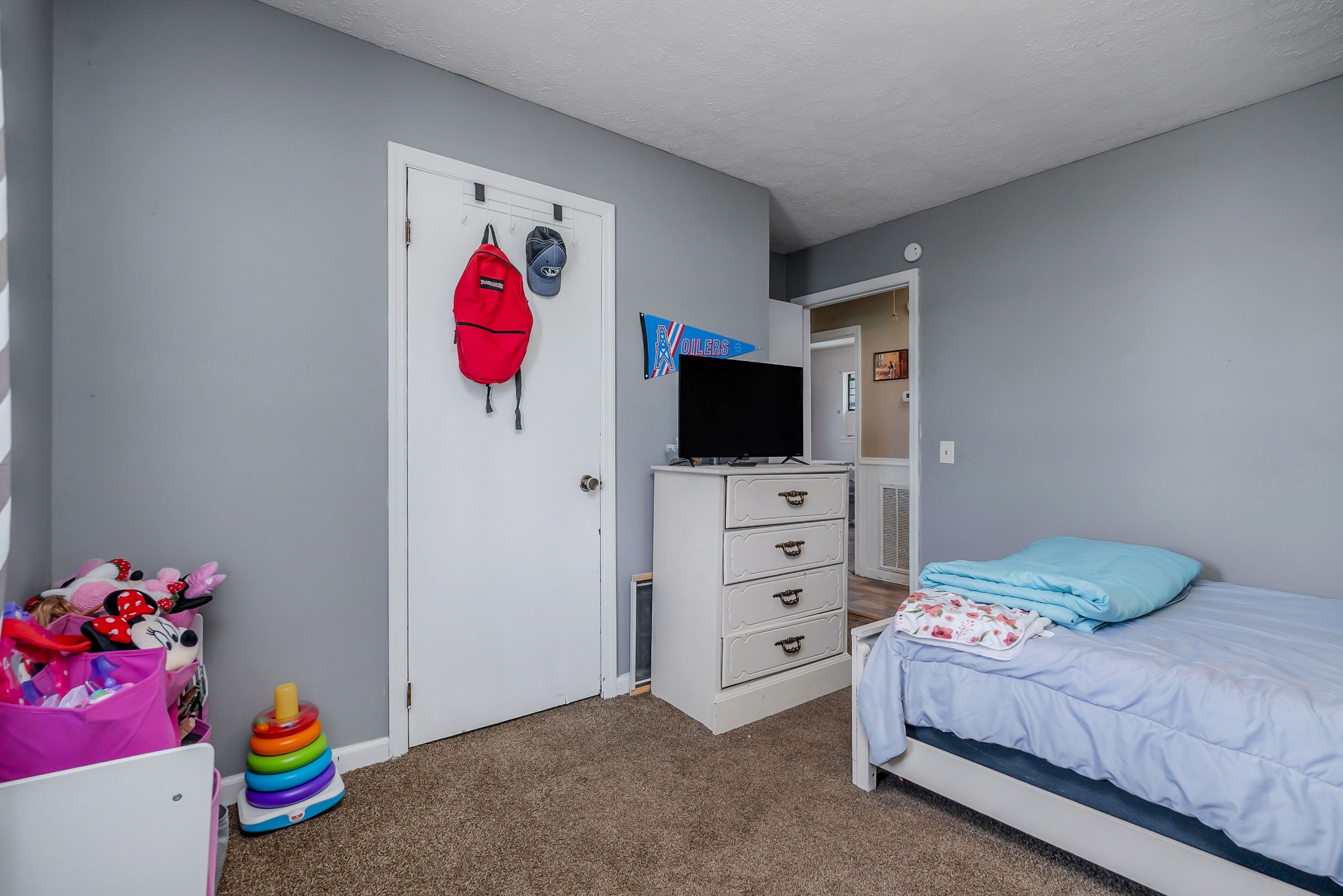 409 Kendra Drive Smithville, TN 37166 - Photo 16 of 27 a bedroom with a bed a flat screen tv and dresser