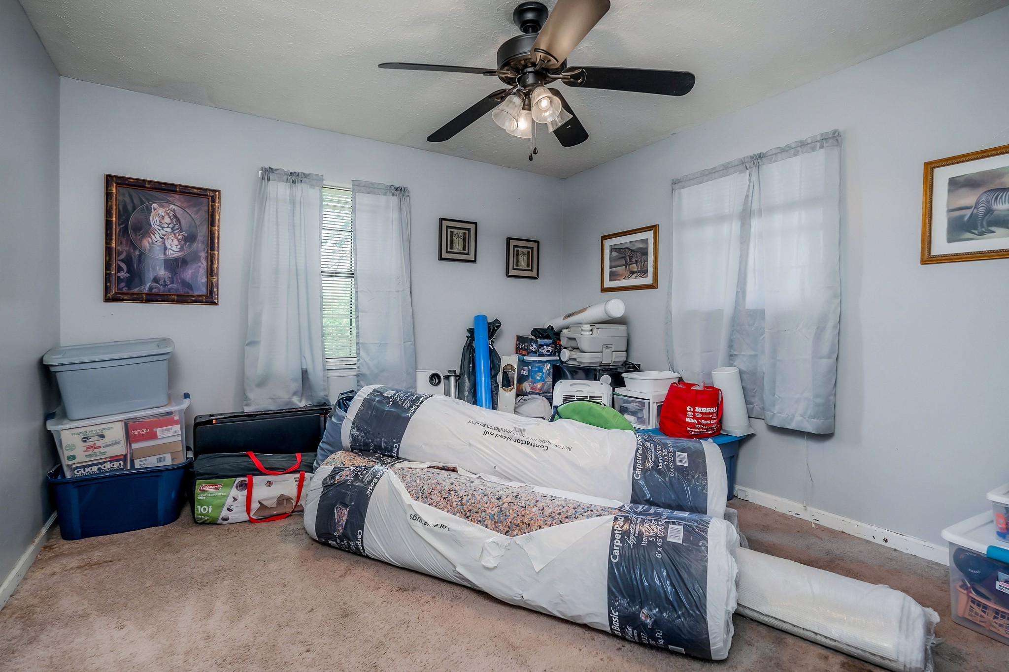 409 Kendra Drive Smithville, TN 37166 - Photo 18 of 27 a bedroom with bed and a chandelier