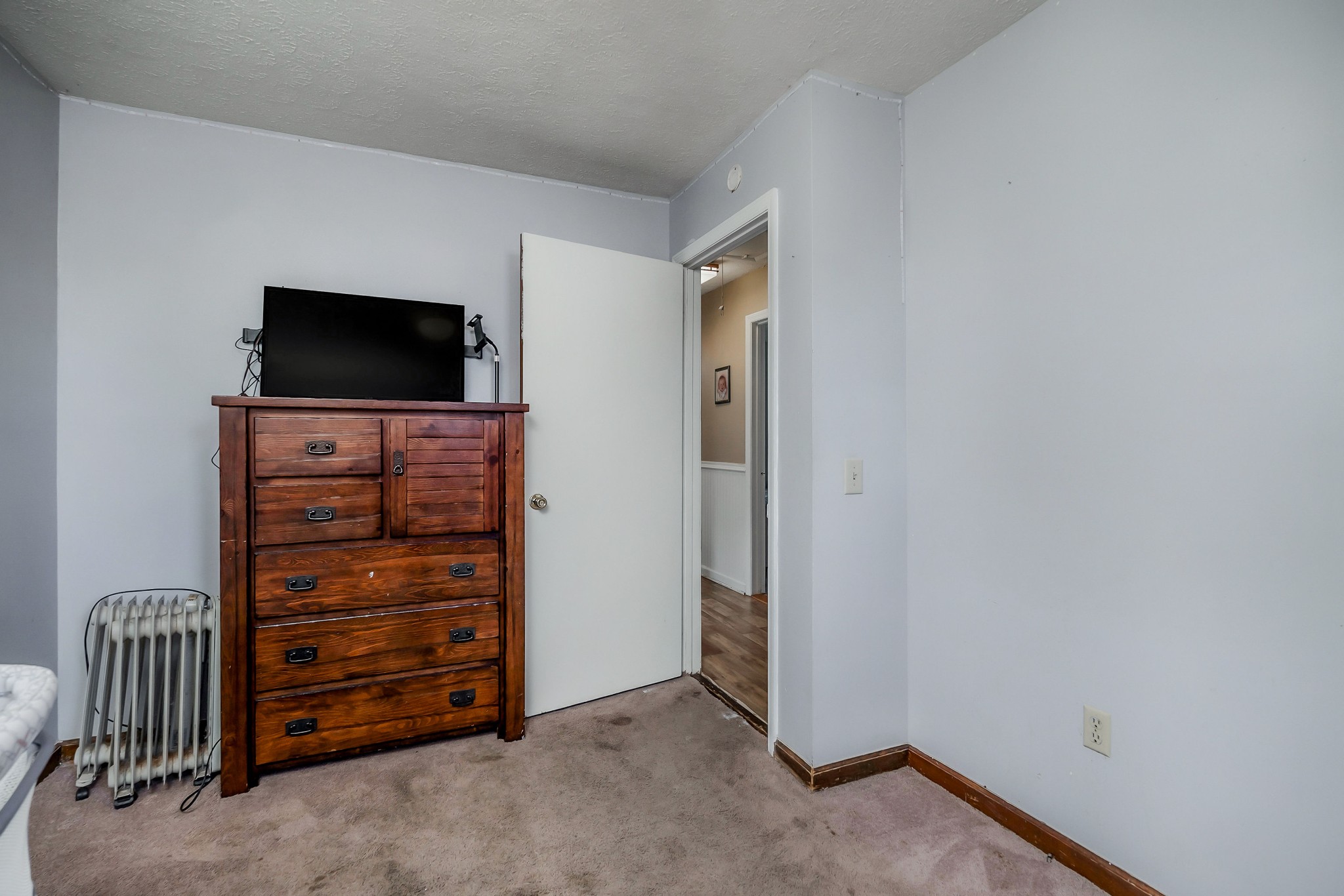 409 Kendra Drive Smithville, TN 37166 - Photo 20 of 27 an empty room with furniture and a flat screen tv
