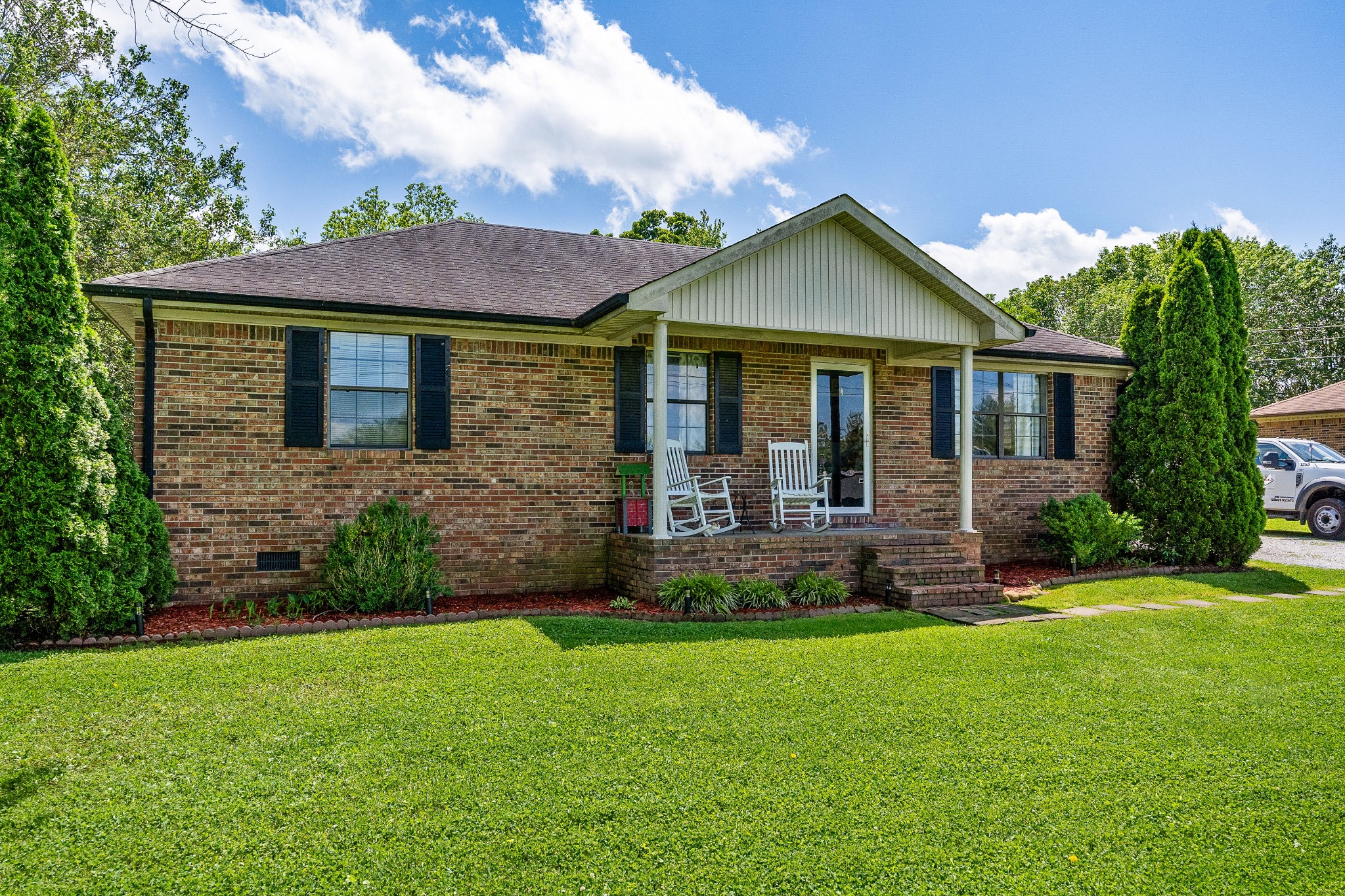 409 Kendra Drive Smithville, TN 37166 - Photo 2 of 27 a front view of a house with a yard