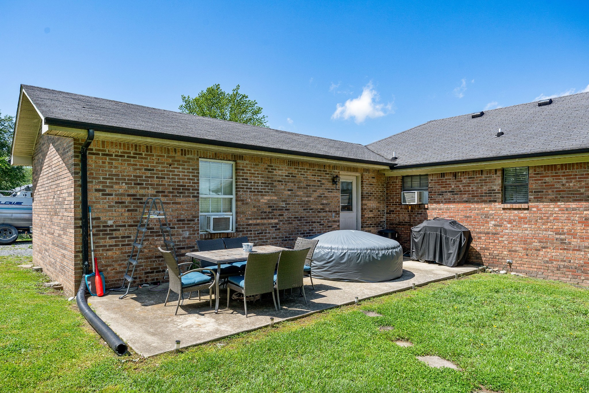 409 Kendra Drive Smithville, TN 37166 - Photo 22 of 27 a view of a patio with table and chairs potted plants with wooden fence