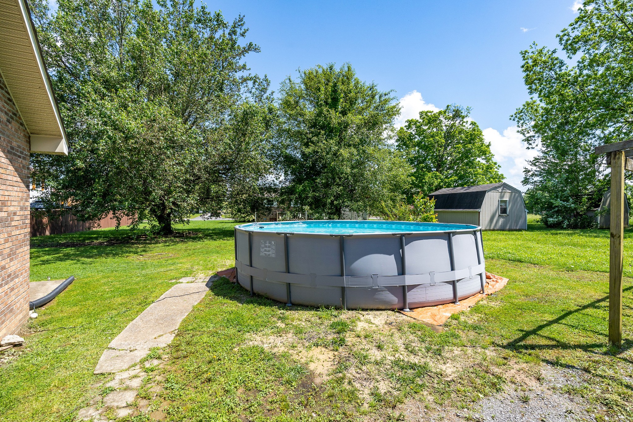 409 Kendra Drive Smithville, TN 37166 - Photo 24 of 27 a view of a garden with a bench