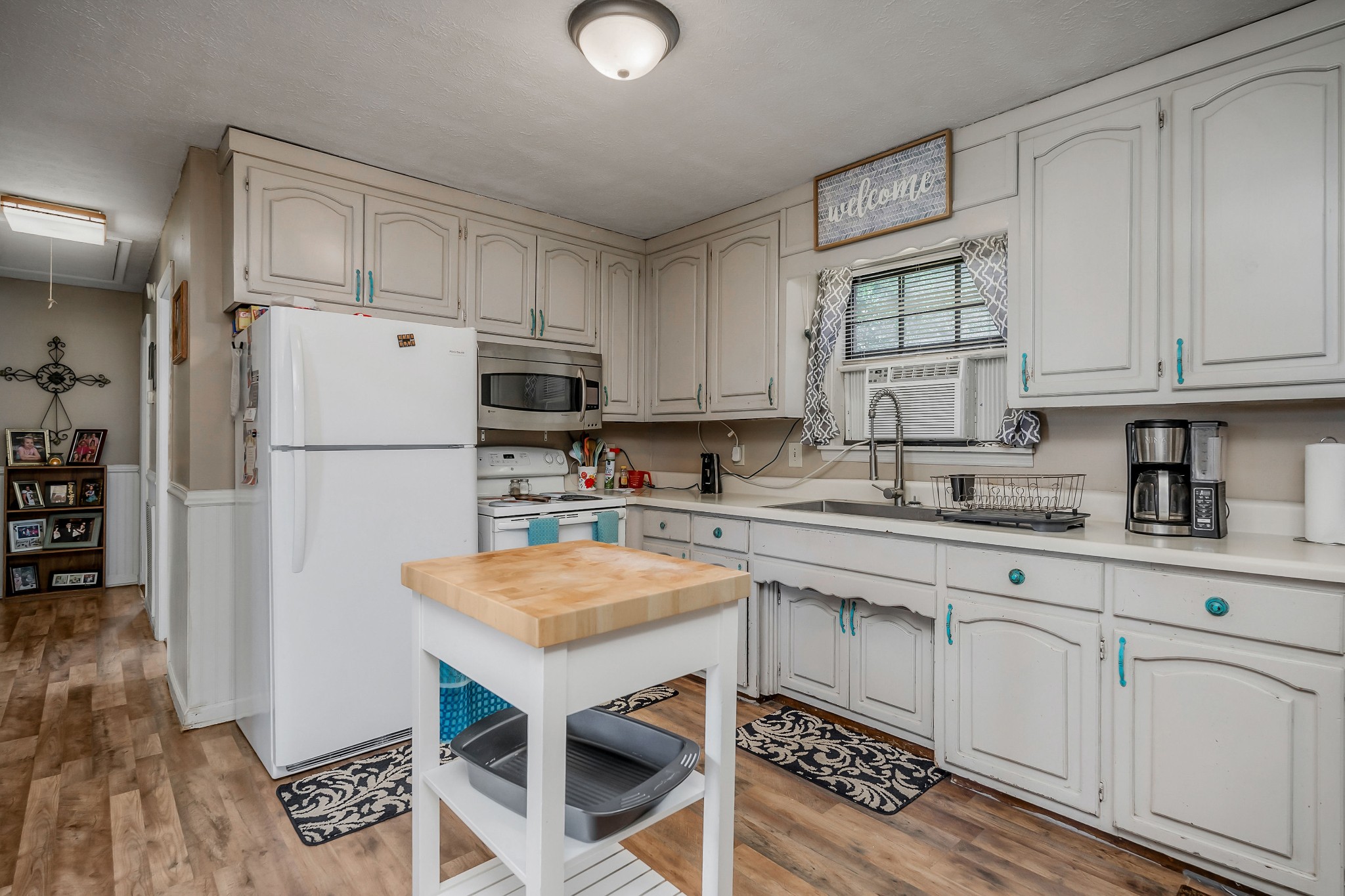 409 Kendra Drive Smithville, TN 37166 - Photo 7 of 27 a kitchen with stainless steel appliances granite countertop a refrigerator sink and cabinets