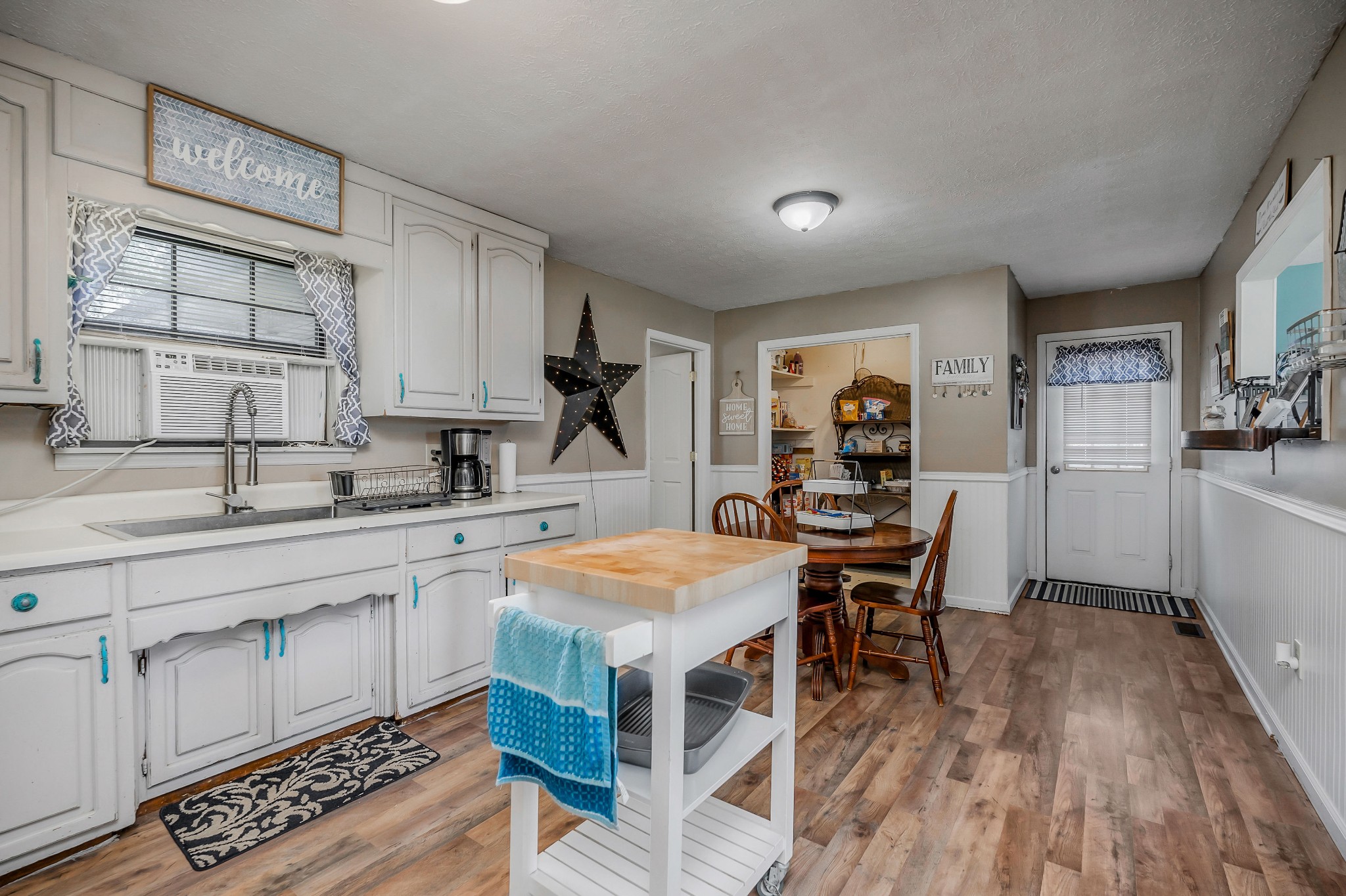 409 Kendra Drive Smithville, TN 37166 - Photo 8 of 27 a kitchen with stainless steel appliances granite countertop a sink and a stove