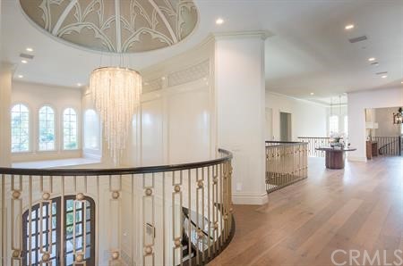 18 Dovetail Lane Bradbury, CA 91008 - Photo 14 of 40 a view of a hallway to a livingroom with furniture and wooden floor