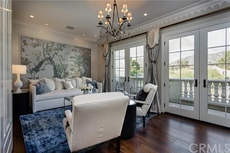 18 Dovetail Lane Bradbury, CA 91008 - Photo 20 of 40 a living room with furniture and a chandelier