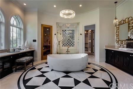 18 Dovetail Lane Bradbury, CA 91008 - Photo 22 of 40 a living room with a couch and a chandelier