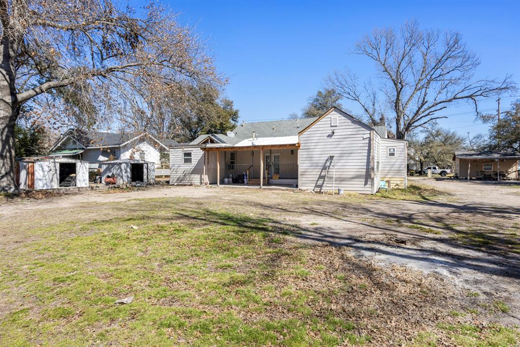 811 Ward Street Marlin, TX 76661 - Photo 25 of 31 Rear view of property with a yard