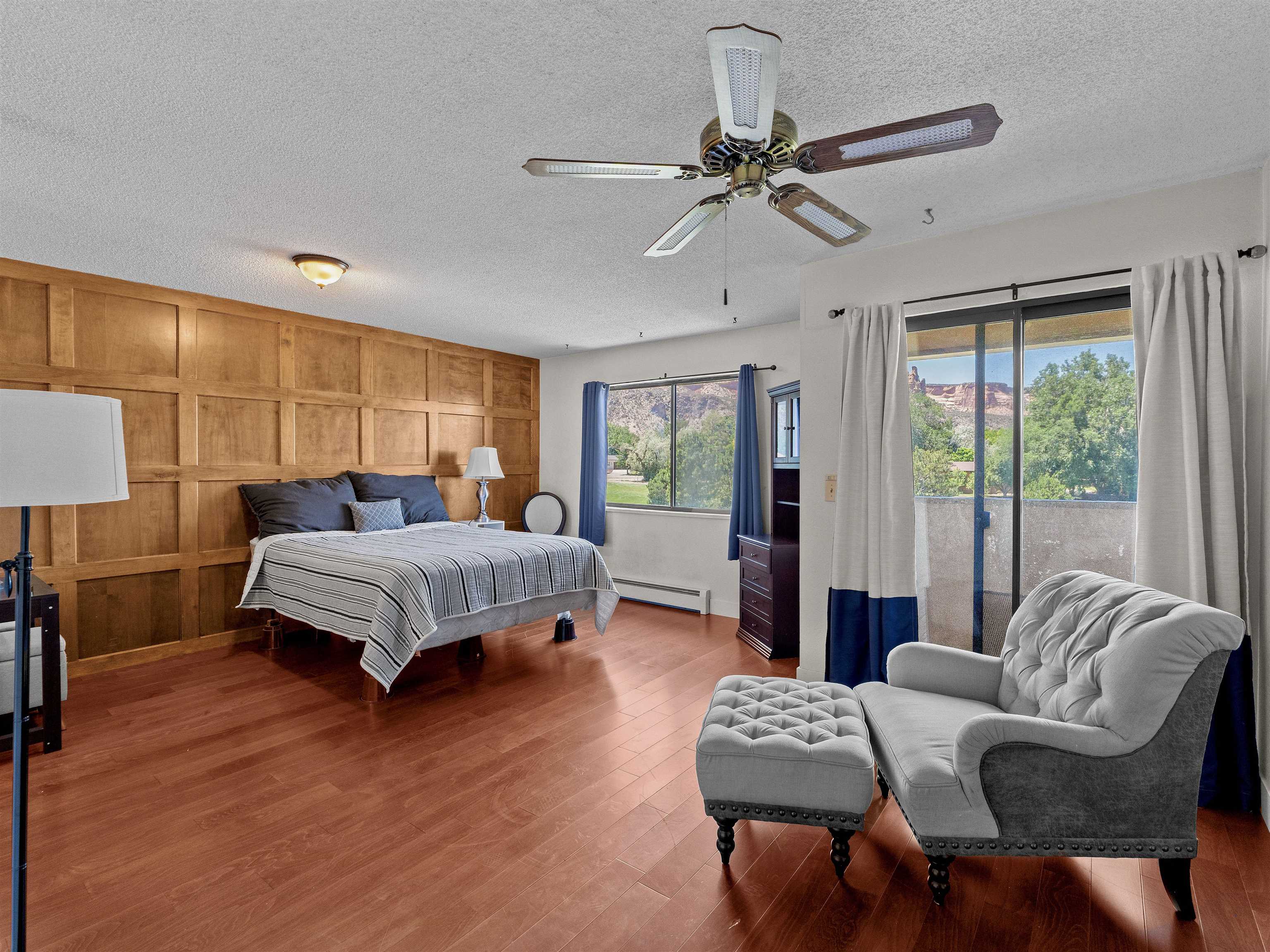 517 Rado Drive, Unit D Grand Junction, CO 81507 - Photo 13 of 24 a bedroom with a bed a couch and a window