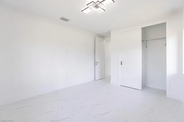 an empty room with a bathroom