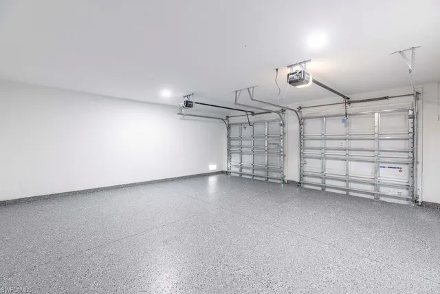 a bathroom with 2 sink and a mirror