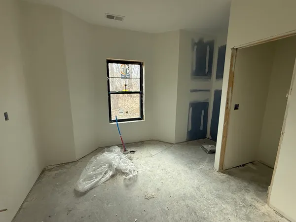 a bathroom with a bathtub and shower
