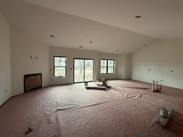 a bed room with a bed and a chair