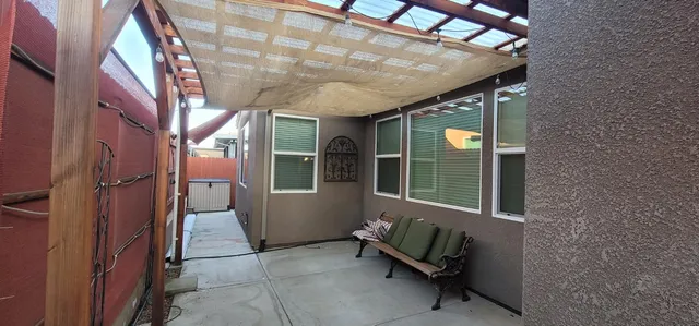 a view of an outdoor space with porch and patio