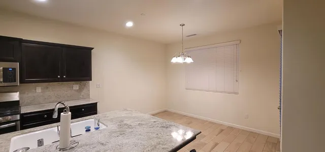 a kitchen with a stove and a microwave