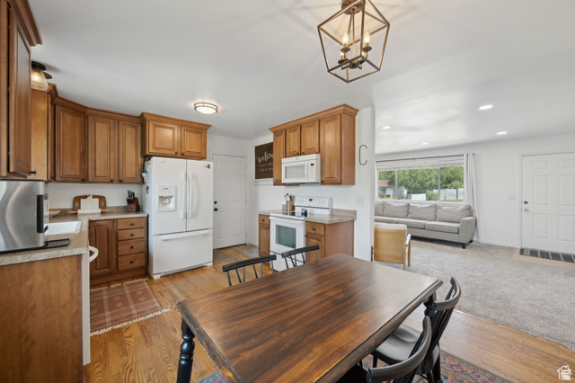 495 North 250 West Springville, UT 84663 - Photo 9 of 35 Dining space featuring suspended lighting and light wood-style floors