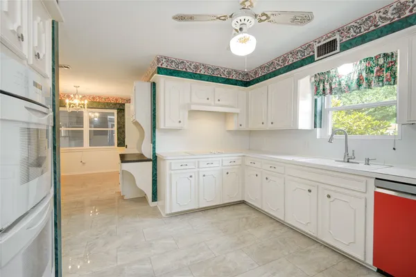 a large kitchen with a large window