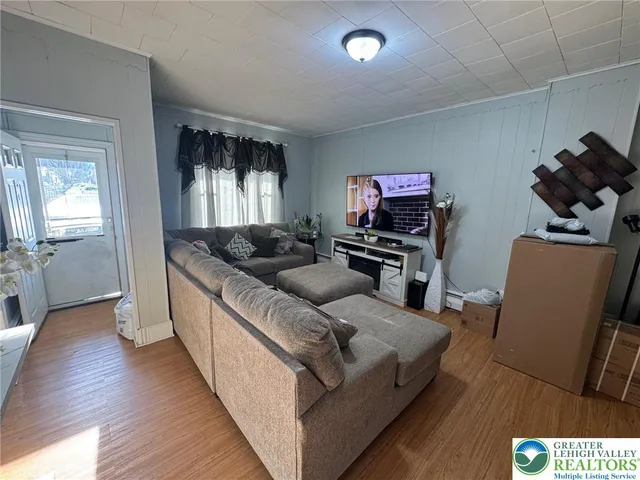 a living room with furniture and a flat screen tv