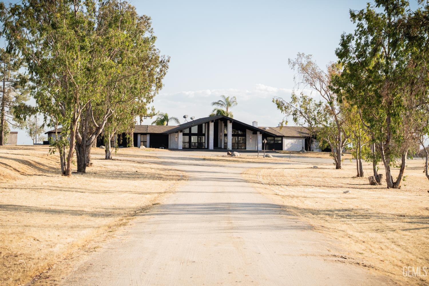 Undisclosed Address Bakersfield, CA 93308 - Photo 2 of 29 a view of a house with snow on the road