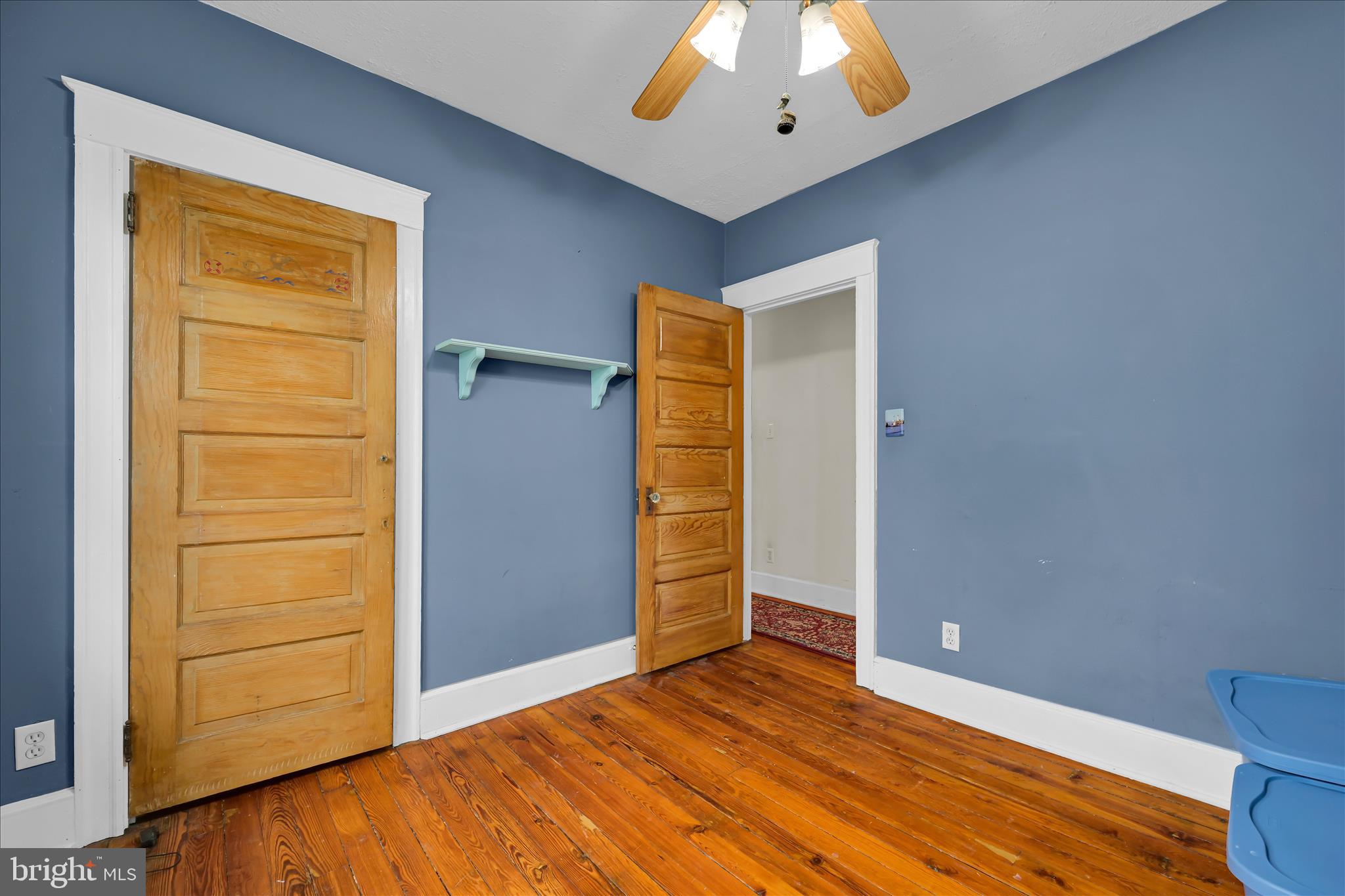 121 East Cumberland Road Enola, PA 17025 - Photo 18 of 27 an empty room with wooden floor closet and chandelier fan