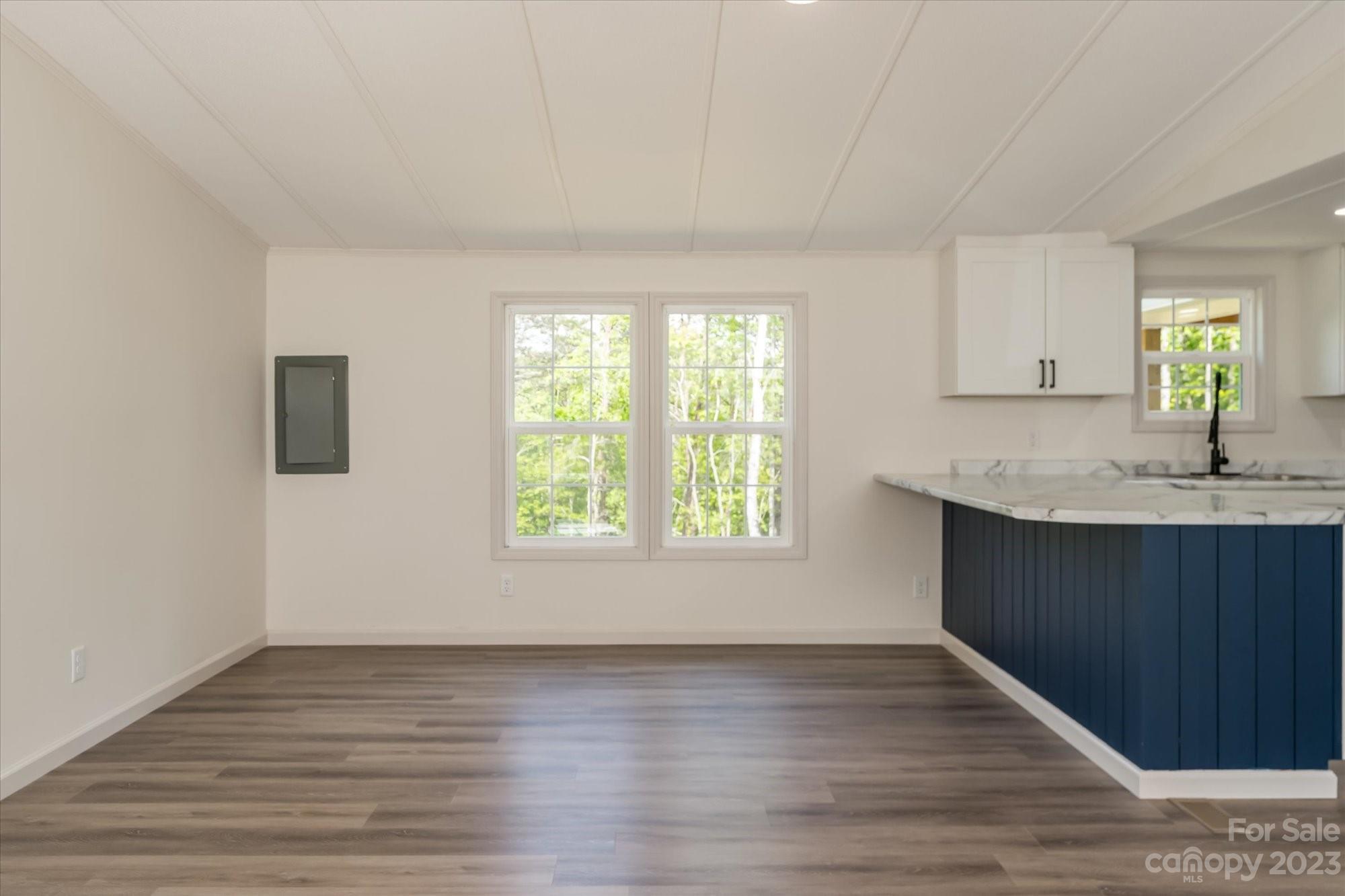 175 King Stepp Road Mill Spring, NC 28756 - Photo 16 of 46 a view of a kitchen with wooden floor and electronic appliances