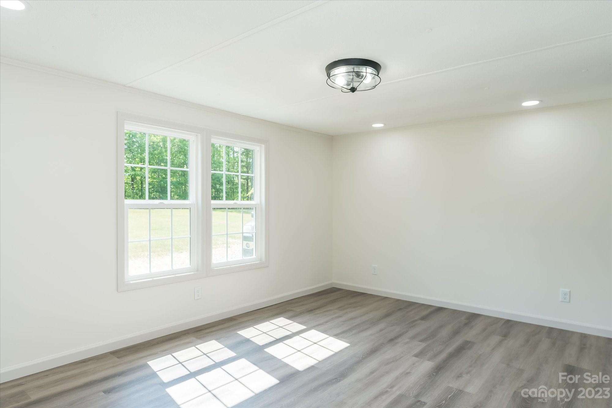 175 King Stepp Road Mill Spring, NC 28756 - Photo 17 of 46 an empty room with a window
