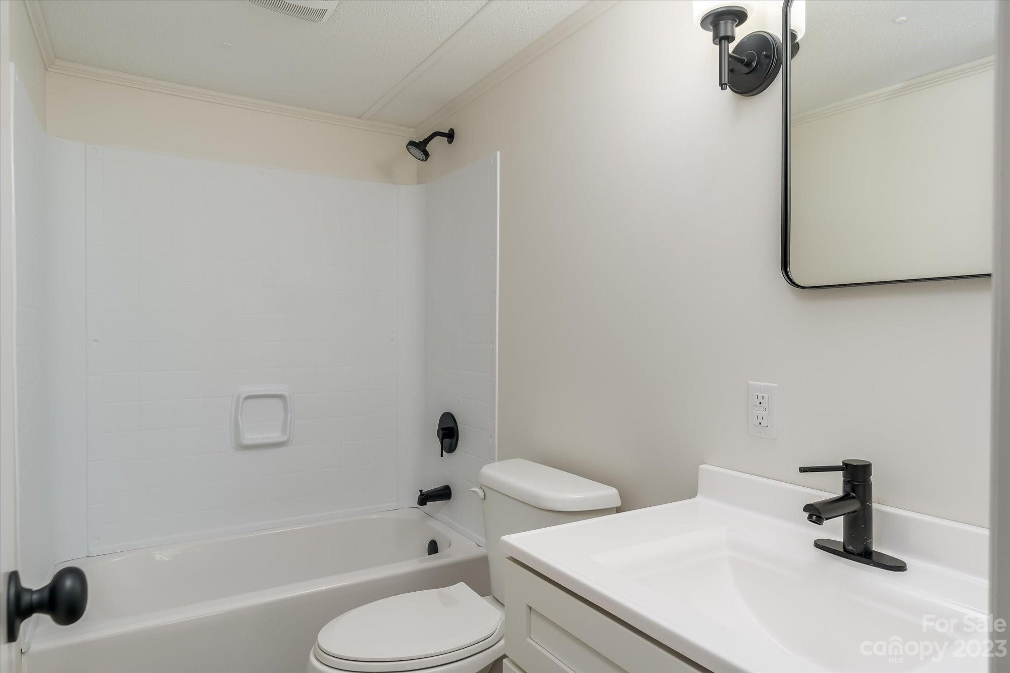 175 King Stepp Road Mill Spring, NC 28756 - Photo 22 of 46 a bathroom with a sink toilet and shower