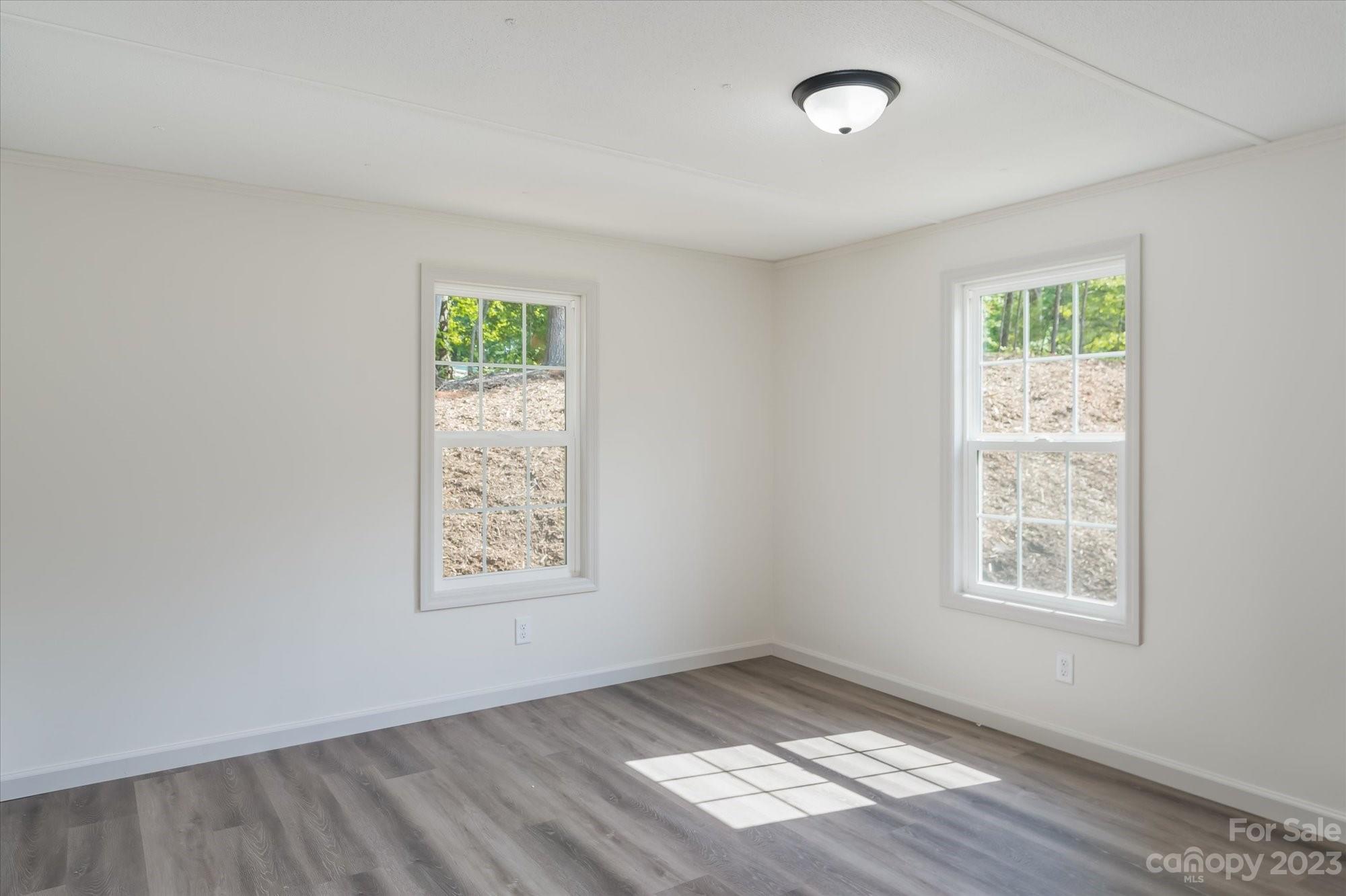 175 King Stepp Road Mill Spring, NC 28756 - Photo 23 of 46 a view of an empty room and window