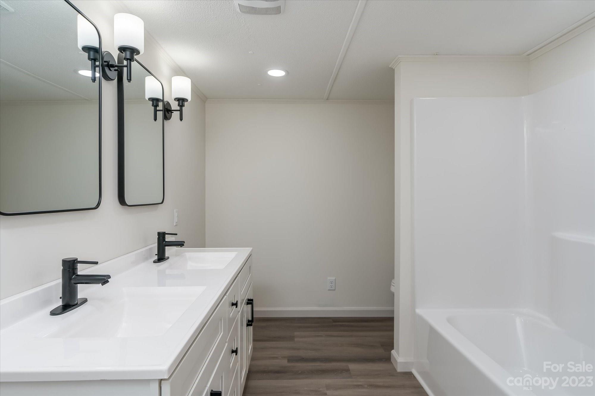 175 King Stepp Road Mill Spring, NC 28756 - Photo 25 of 46 a bathroom with a sink and a mirror