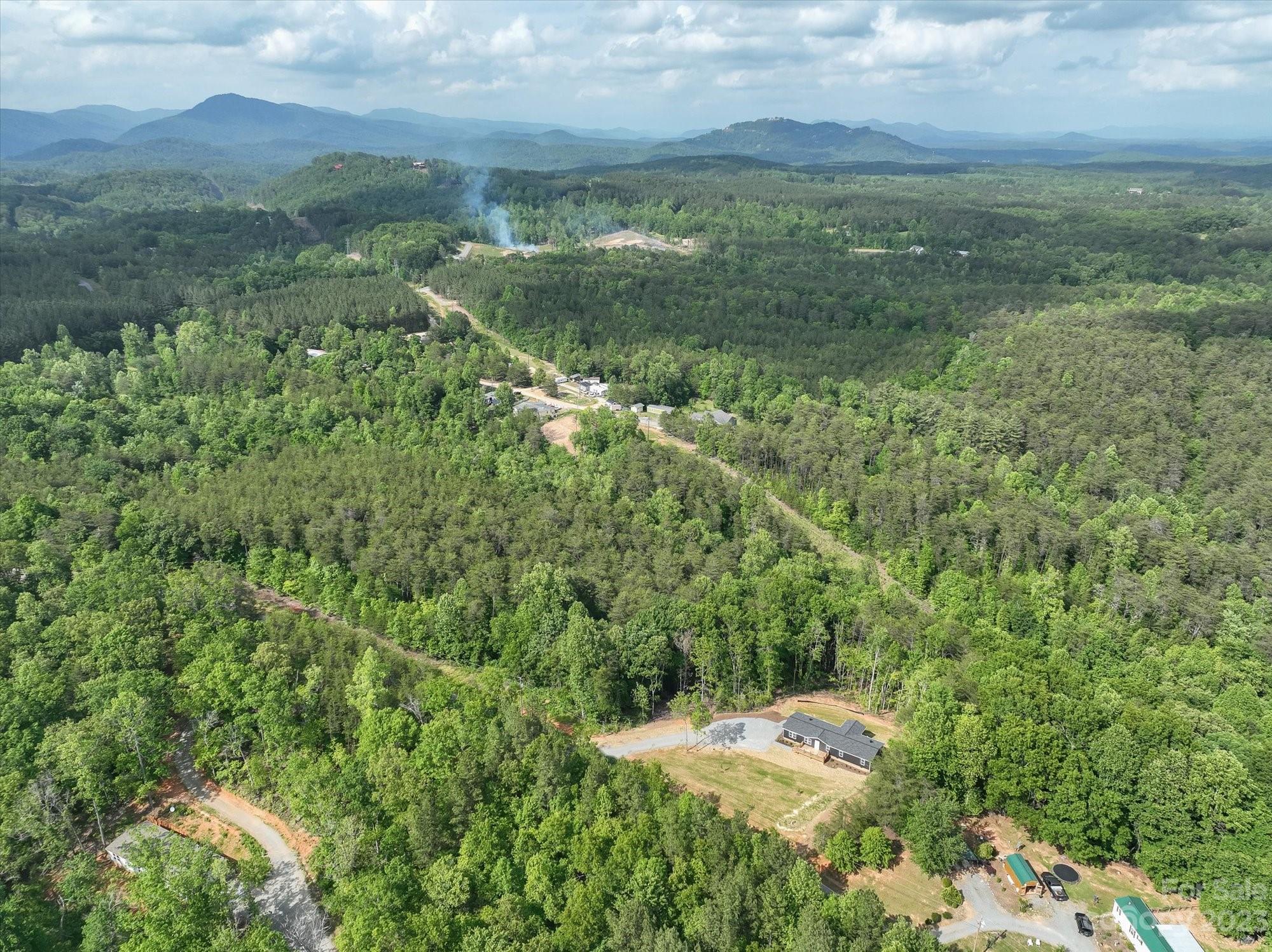175 King Stepp Road Mill Spring, NC 28756 - Photo 30 of 46 a view of a lake with a mountain