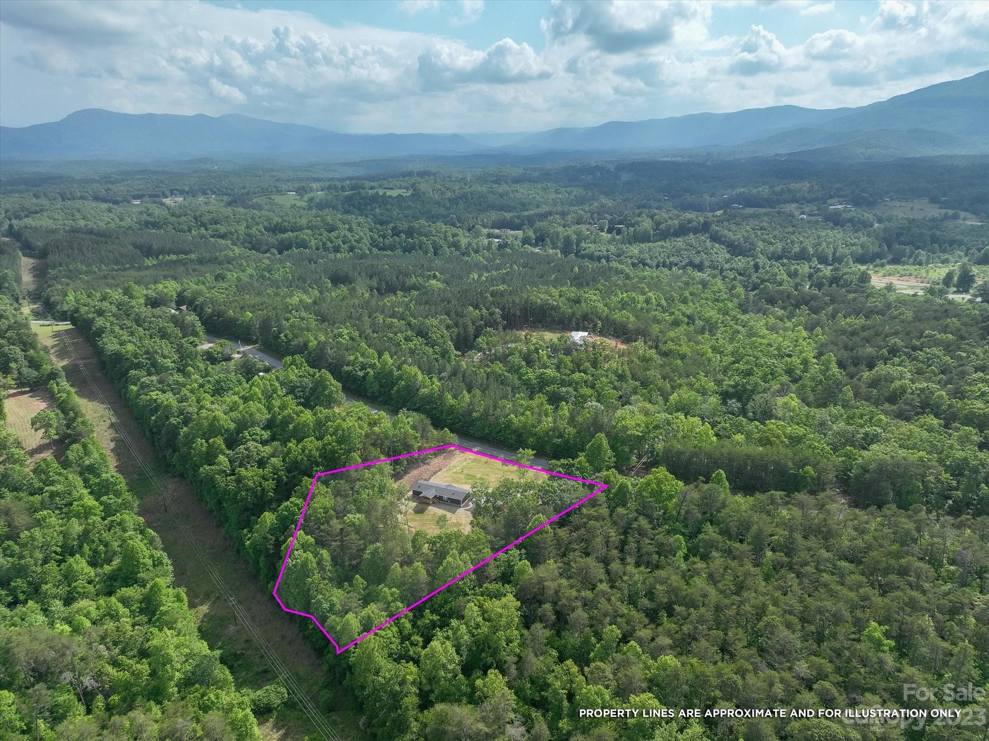 175 King Stepp Road Mill Spring, NC 28756 - Photo 33 of 46 an aerial view of a houses with yard and green space