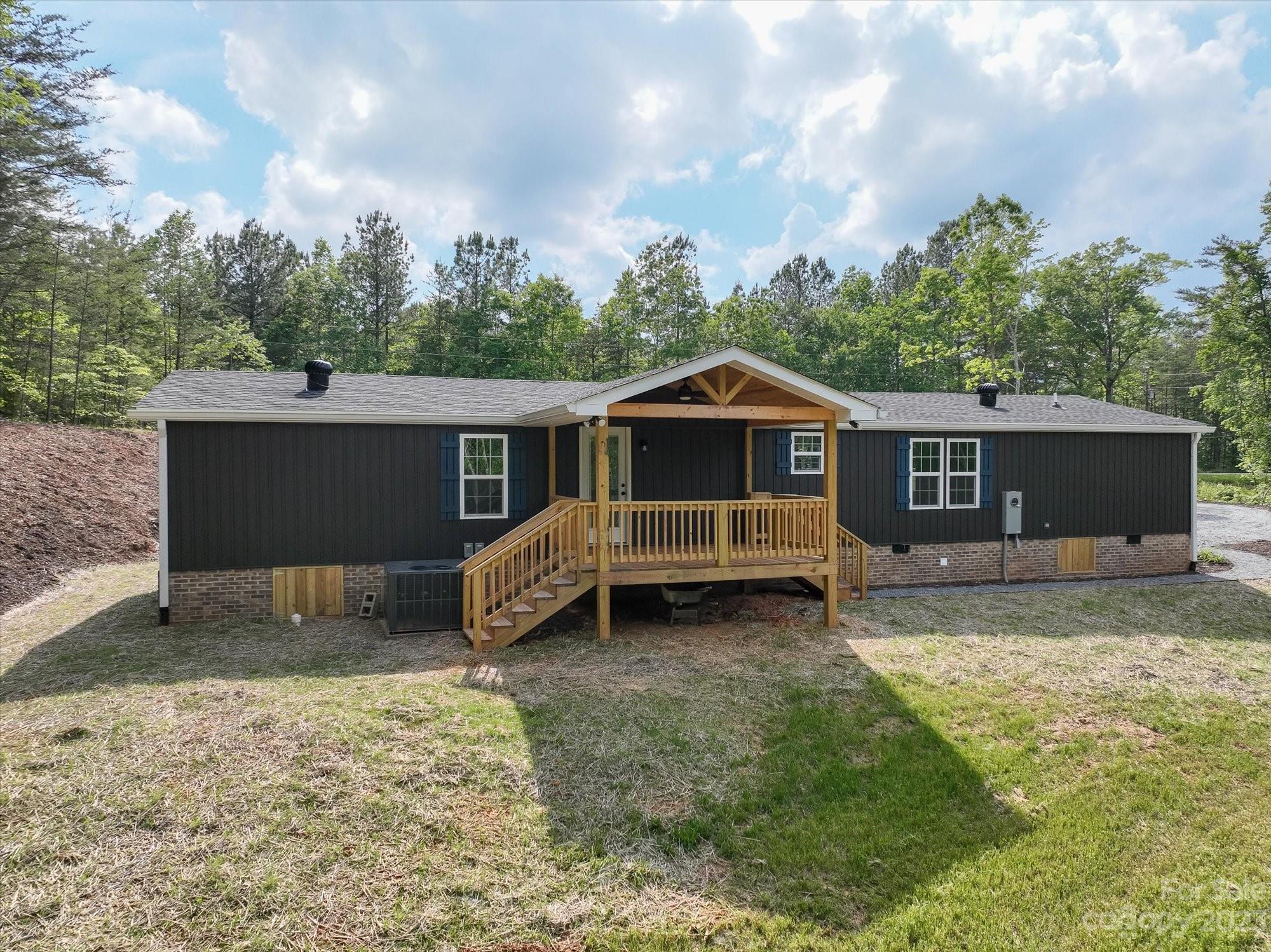 175 King Stepp Road Mill Spring, NC 28756 - Photo 37 of 46 a front view of a house with a yard