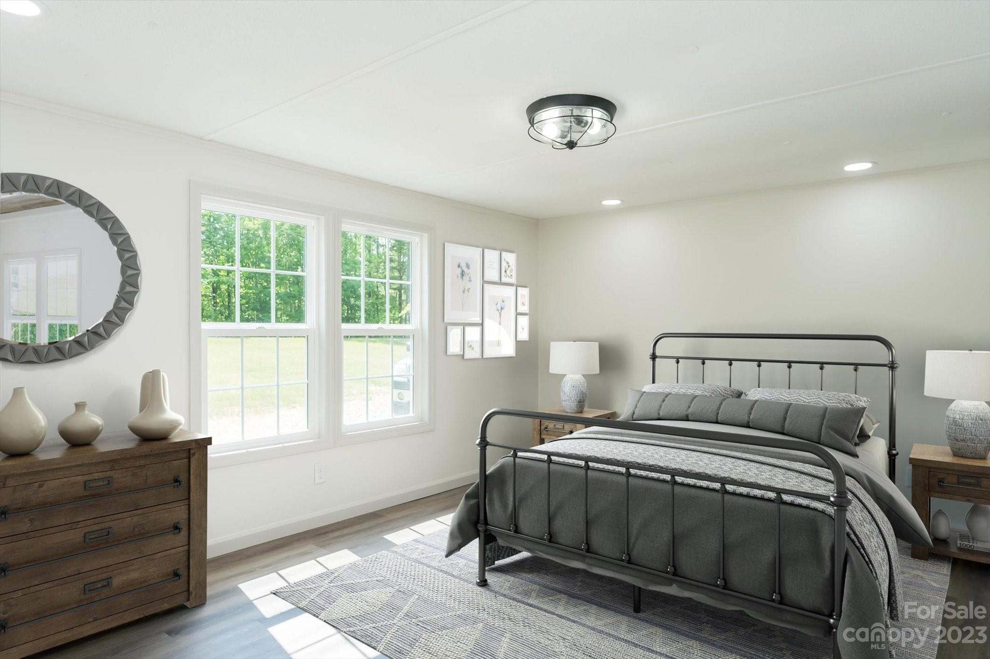 175 King Stepp Road Mill Spring, NC 28756 - Photo 39 of 46 a bedroom with a bed and window