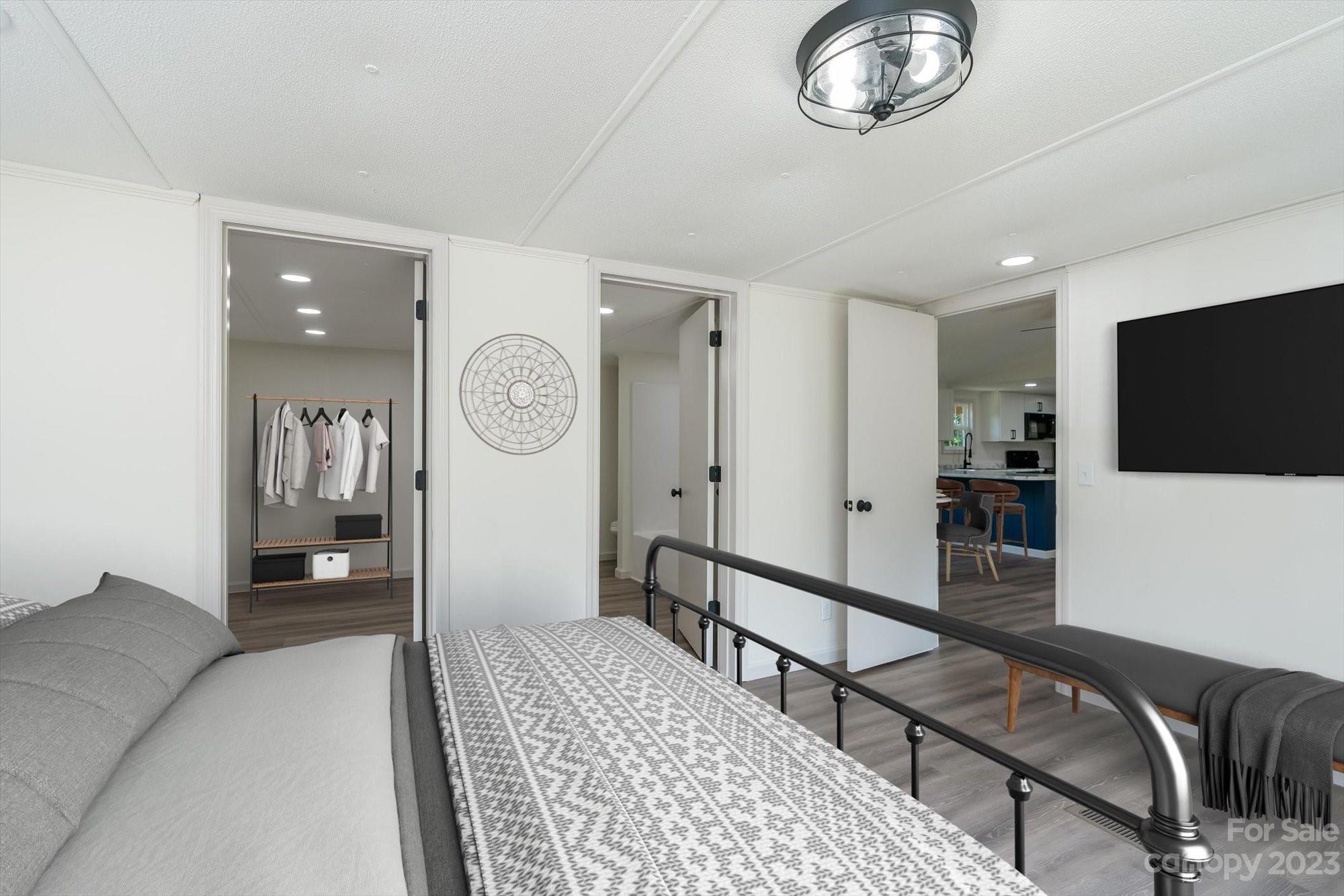 175 King Stepp Road Mill Spring, NC 28756 - Photo 40 of 46 a bedroom with furniture and a mirror