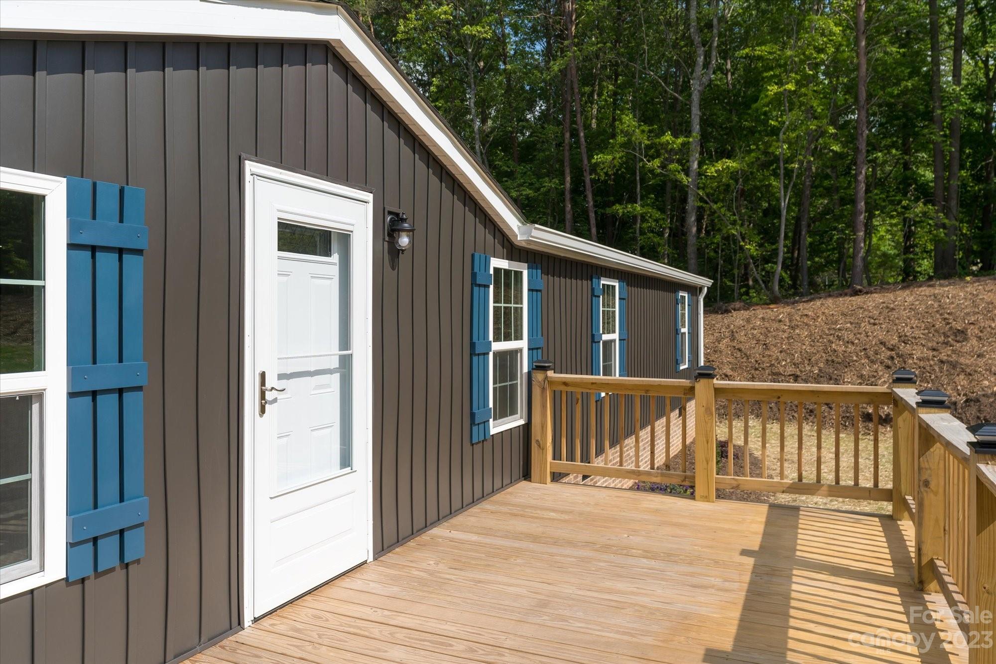 175 King Stepp Road Mill Spring, NC 28756 - Photo 4 of 46 a view of a house with backyard and deck