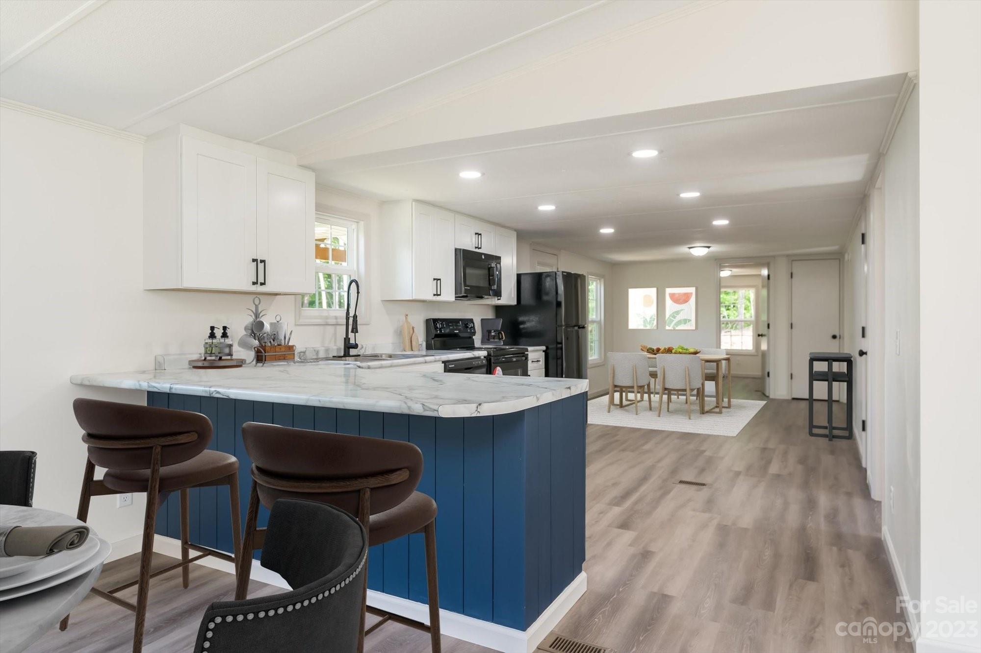 175 King Stepp Road Mill Spring, NC 28756 - Photo 41 of 46 a kitchen with counter top space a sink appliances and cabinets