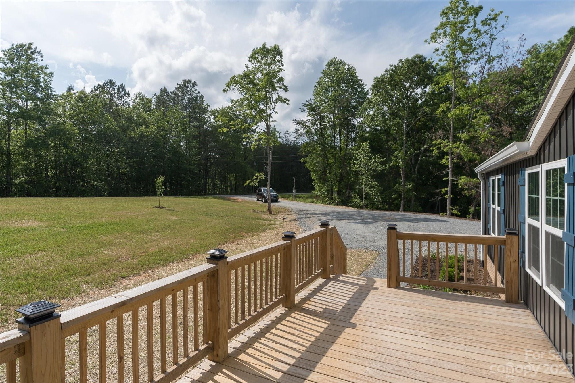 175 King Stepp Road Mill Spring, NC 28756 - Photo 5 of 46 a view of a balcony with wooden floor and fence