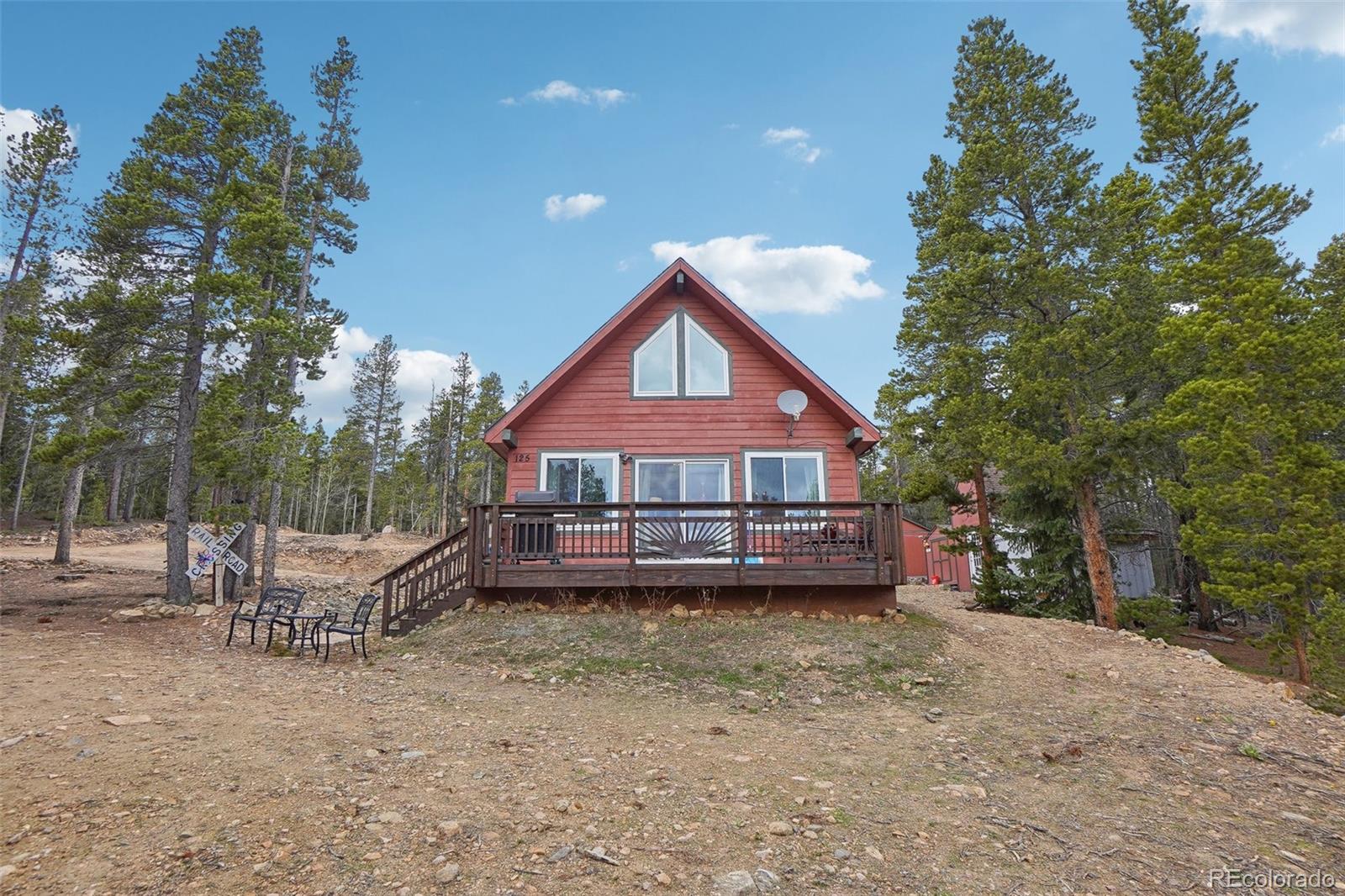125 Aspen Road Black Hawk, CO 80422 - Photo 2 of 44 a front view of a house with a yard and balcony