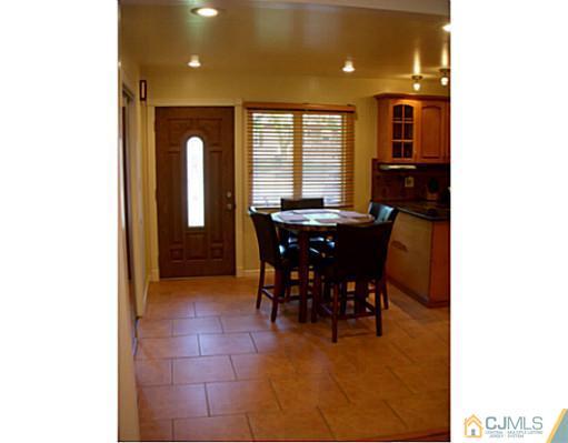 192 Princeton Road Old Bridge, NJ 08859 - Photo 3 of 25 a view of a dining room with furniture and window