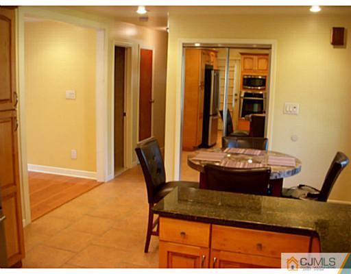 192 Princeton Road Old Bridge, NJ 08859 - Photo 7 of 25 a room with a table and chairs