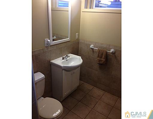 192 Princeton Road Old Bridge, NJ 08859 - Photo 10 of 25 a bathroom with a toilet sink and mirror