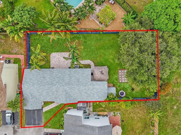 aerial view of a house with garden