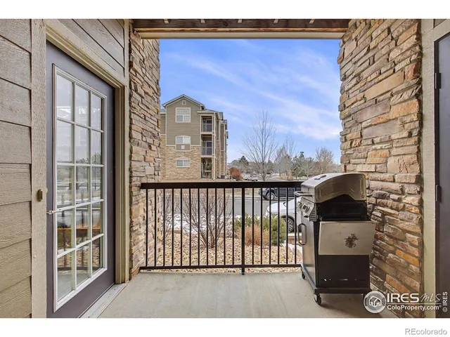 a balcony view with a glass door