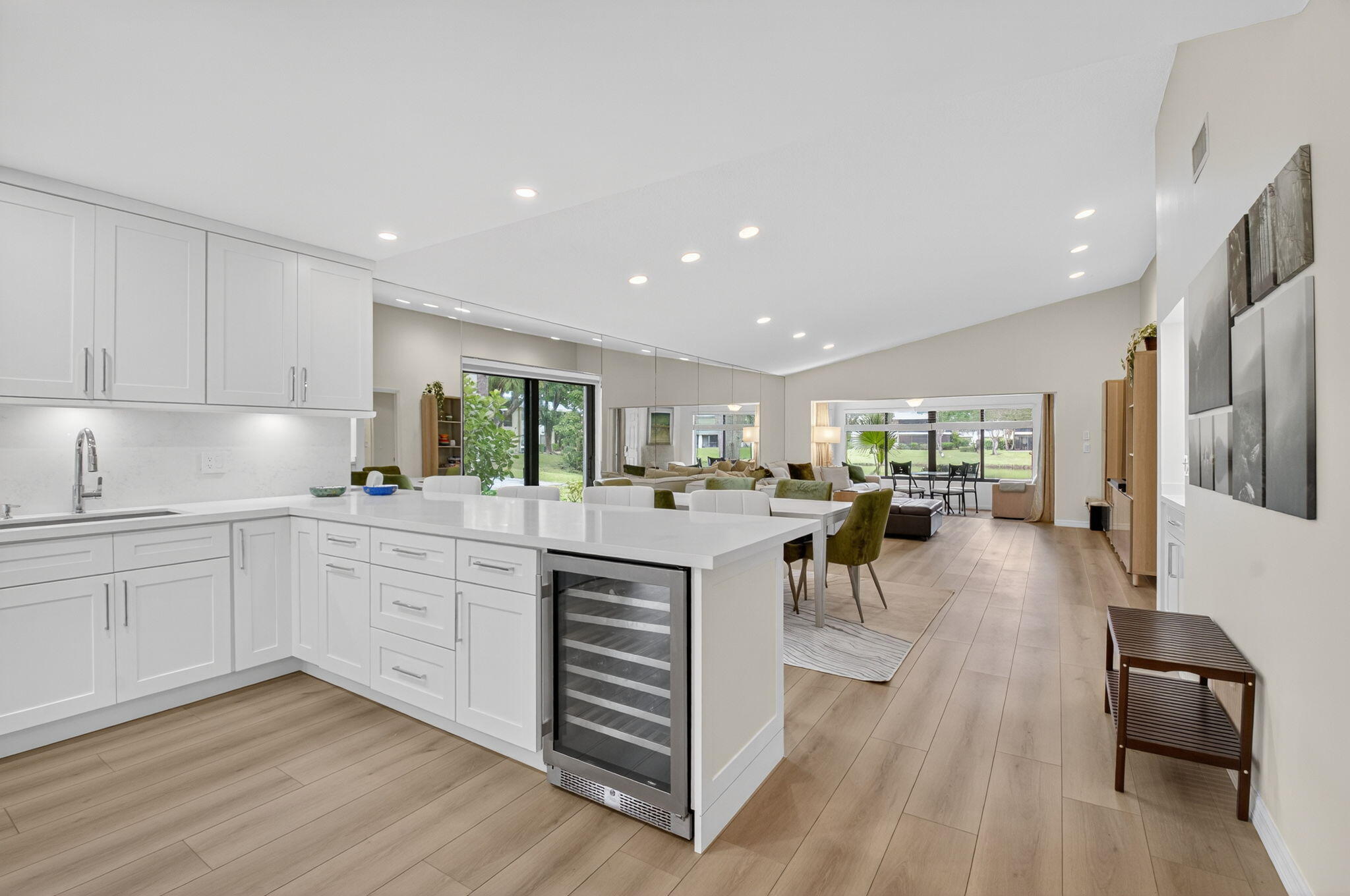 24 Westgate Lane, Unit A Boynton Beach, FL 33436 - Photo 18 of 94 a kitchen with white cabinets and stainless steel appliances