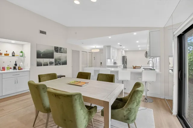 an aerial view of a house with a yard and lake view