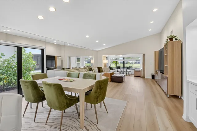 an aerial view of a house with a yard and lake view