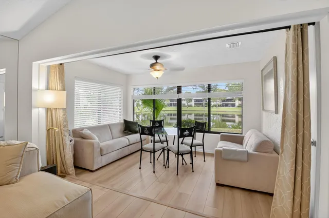 an aerial view of a house with a lake view